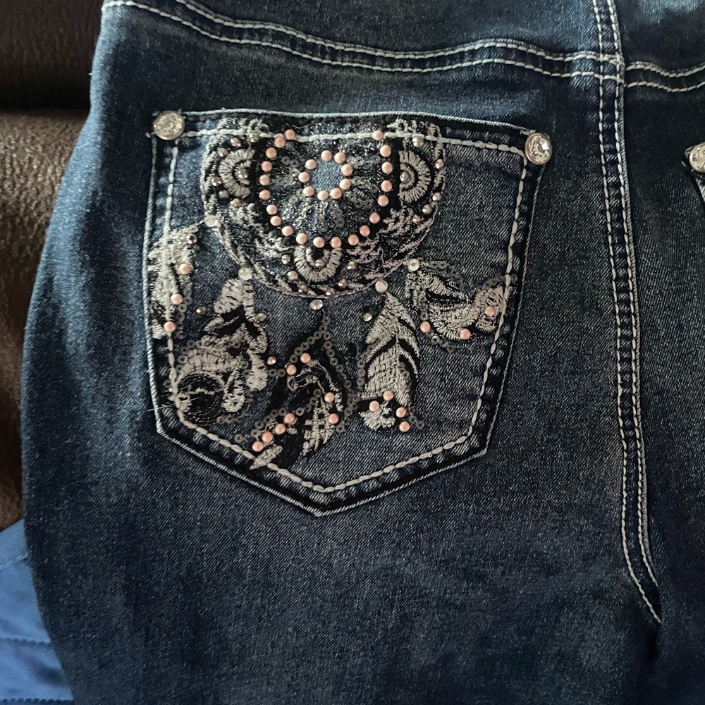 bootcut jeans with design on pockets